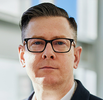 CEO of a crypto trading company, Alexander Hughes, executive headshot